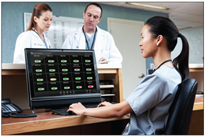 Healthcare employee at their station using the Masimo Patient SafteyNet software on their desktop computer